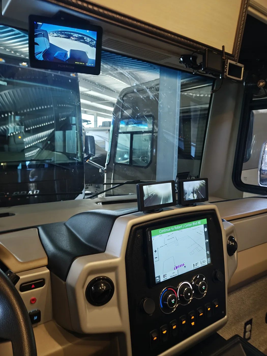 View from the pilot seat showing the overhead rear camera and TPMS monitors