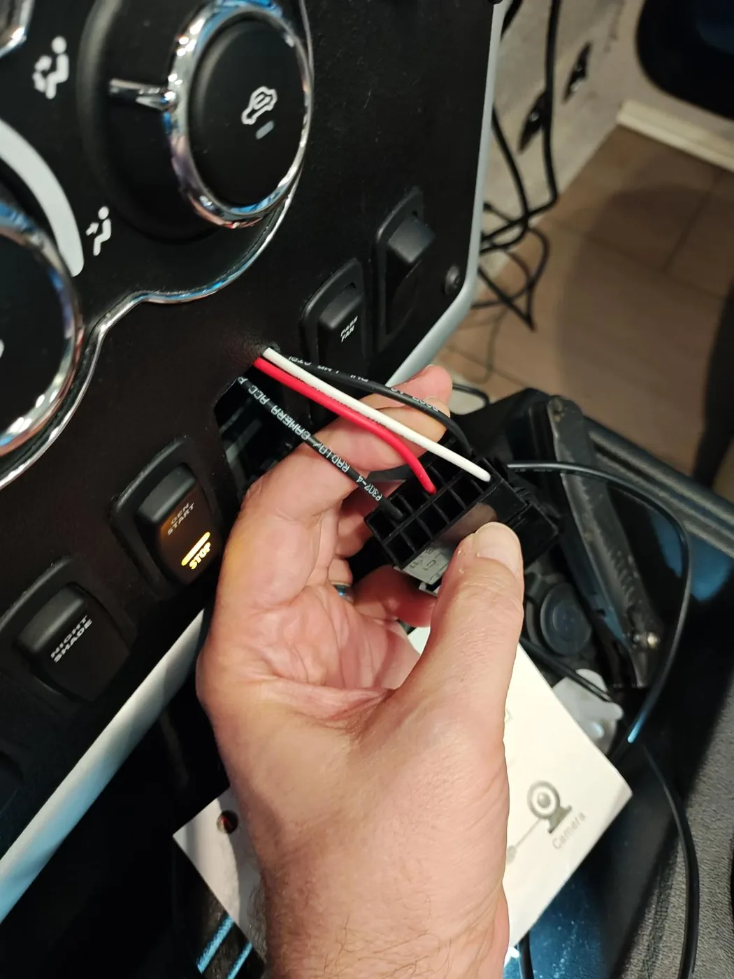 The wiring connector on the back of the RADIO/CAMERA switch